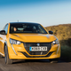 A photo of a yellow Peugeot 208 hatchback.